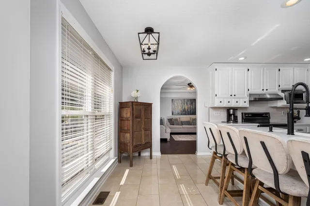 a white bath tub sitting next to a white toilet