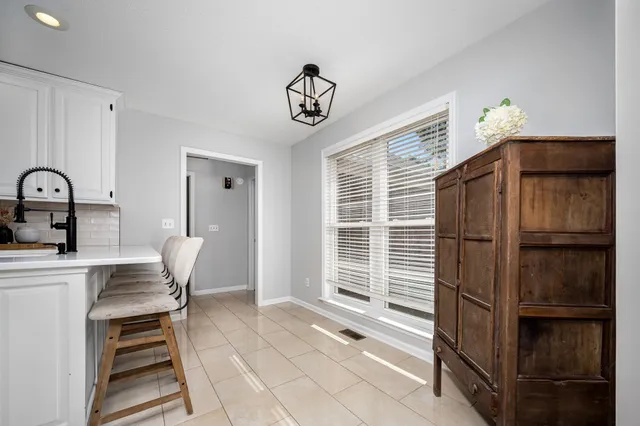 a bedroom with bed and a window