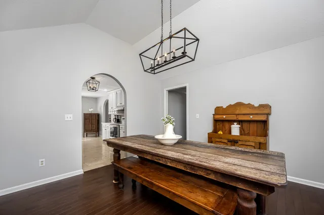 a view of room with wooden floor and window