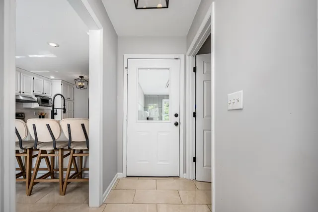 a view of a field with an trees in the background