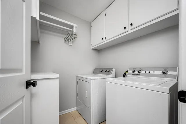 a view of green field with tree in the background