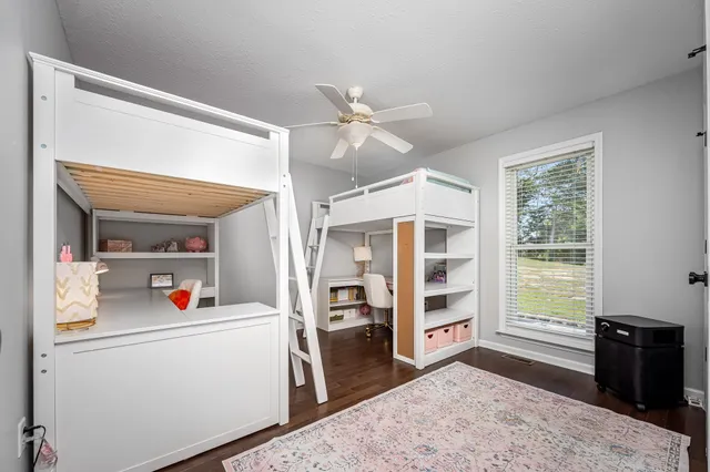 an aerial view of a residential houses with outdoor space