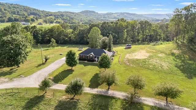 an aerial view of a residential houses with outdoor space