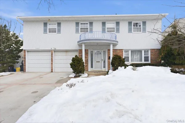 a view of a white house with a outdoor space