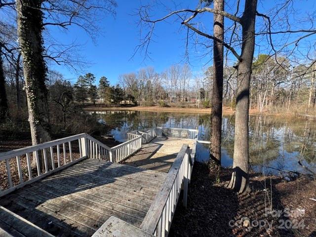 7100 Ridge Lane Road Charlotte, NC 28262 - Photo 7 of 11 a view of a balcony with two chairs and a table