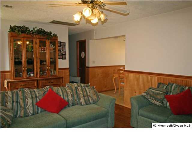 1906 Whitcomb Road Forked River, NJ 08731 - Photo 4 of 10 a living room with furniture and a large window