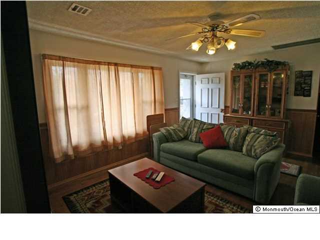 1906 Whitcomb Road Forked River, NJ 08731 - Photo 6 of 10 a living room with furniture and a window