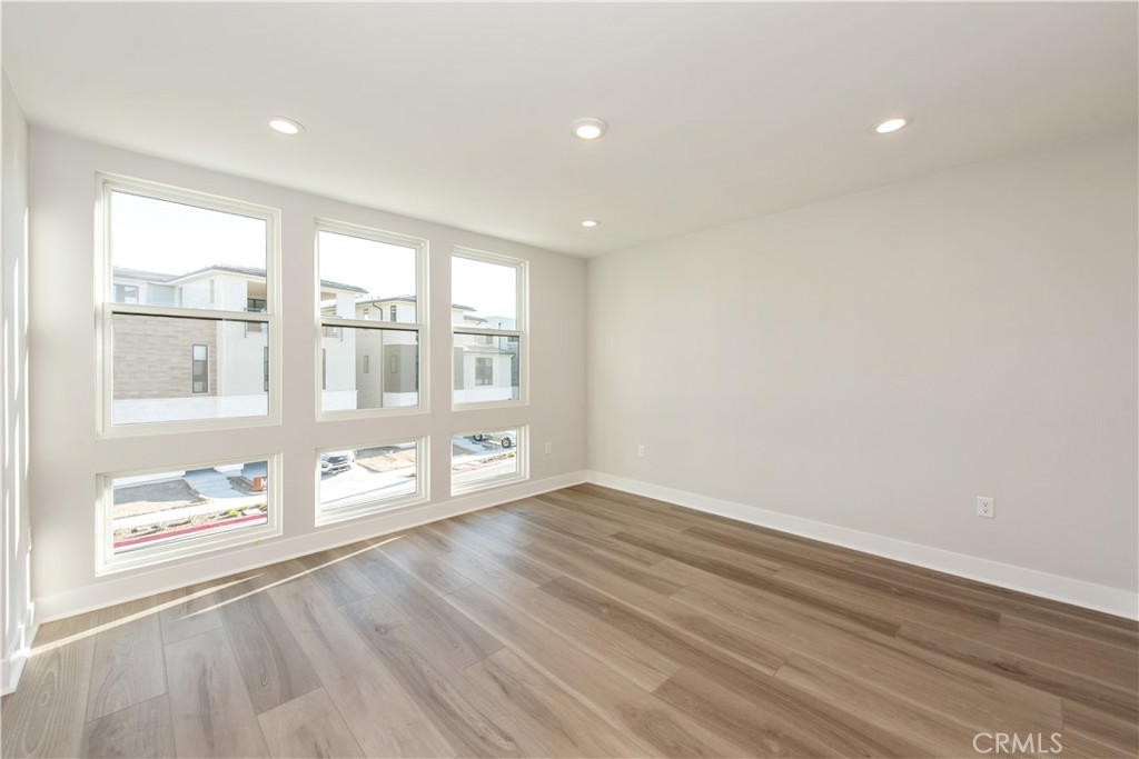 209 Mask Irvine, CA 92618 - Photo 15 of 40 wooden floor in an empty room with a window
