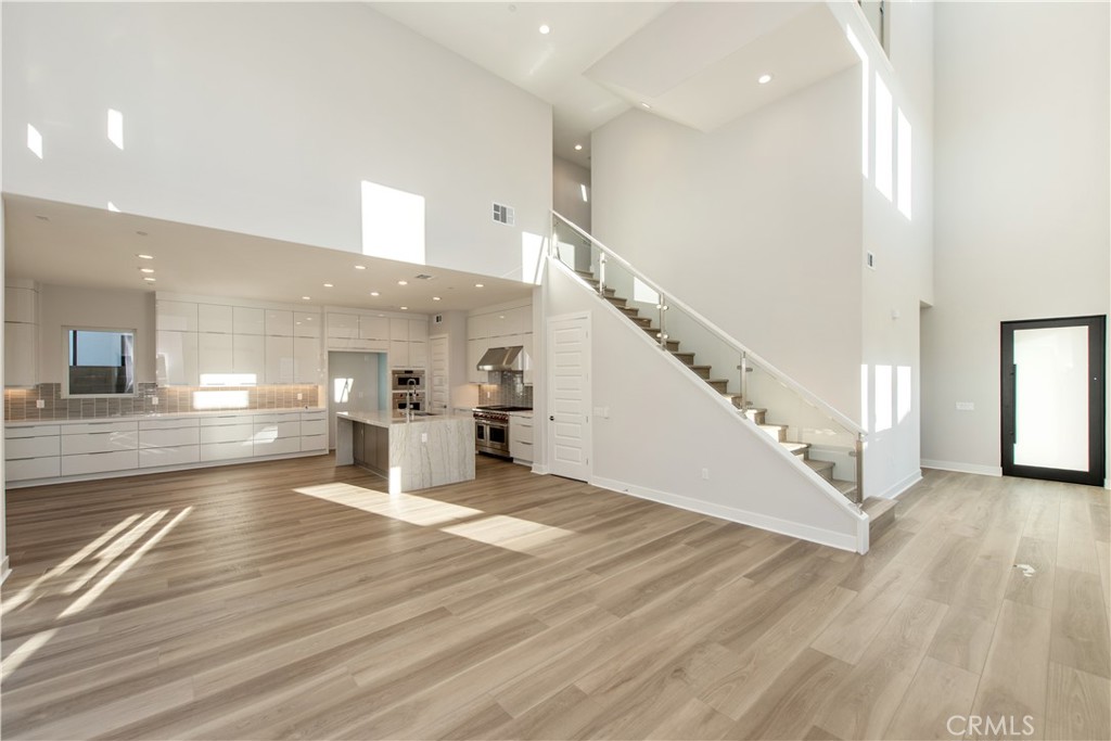 209 Mask Irvine, CA 92618 - Photo 4 of 40 a view of entryway and hall with wooden floor