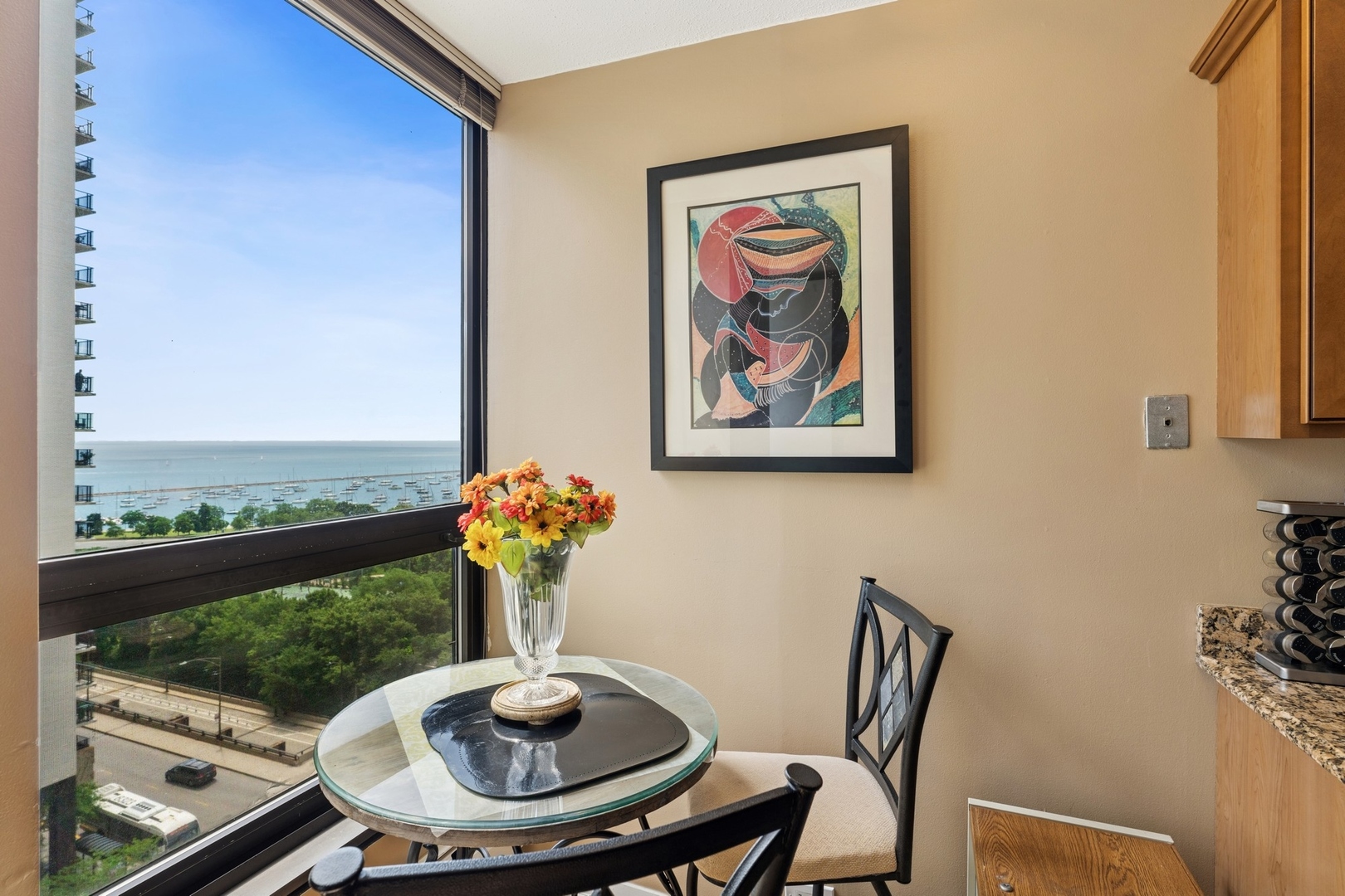 360 East Randolph Street, Unit 1208 Chicago, IL 60601 - Photo 12 of 27 a view of a dining room with furniture window and wooden floor