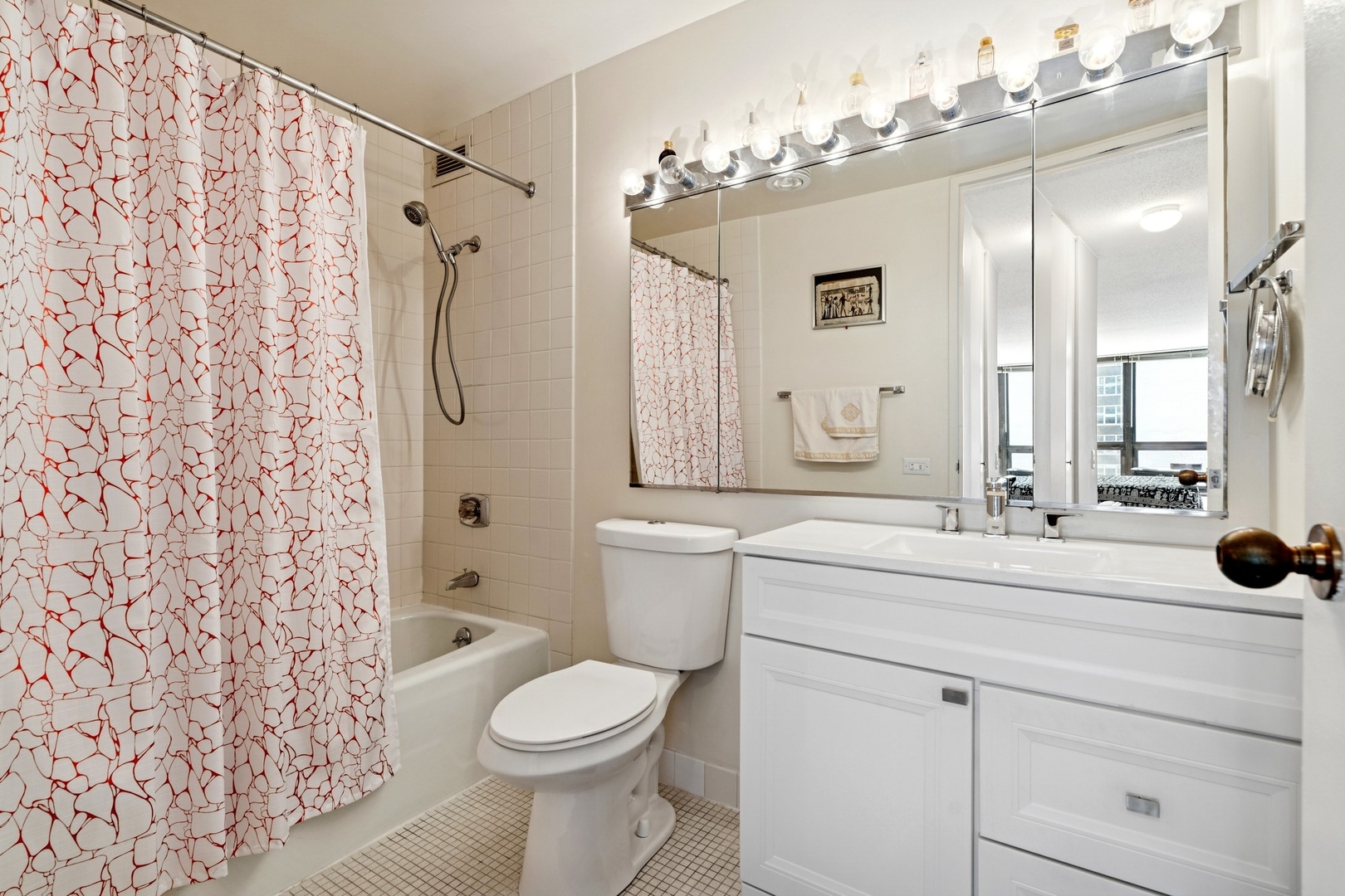 360 East Randolph Street, Unit 1208 Chicago, IL 60601 - Photo 15 of 27 a bathroom with a sink a toilet and shower