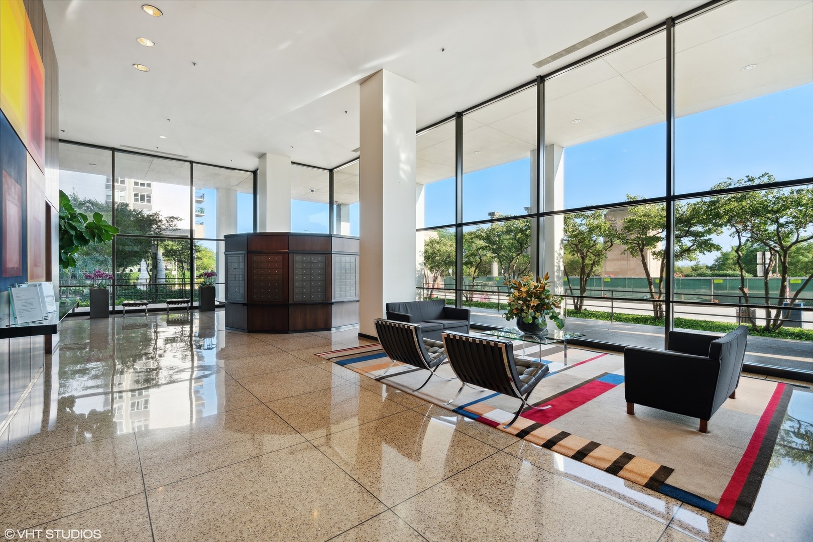 360 East Randolph Street, Unit 1208 Chicago, IL 60601 - Photo 25 of 27 a living room with patio furniture and a floor to ceiling window