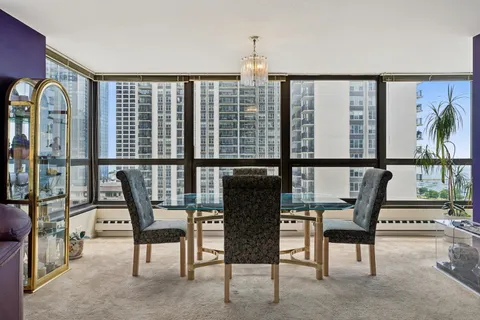 a view of a chairs and table in a room