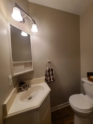 a view of a hallway with a refrigerator