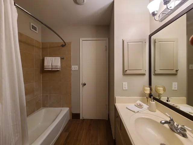 a bathroom with a bathtub and a shower