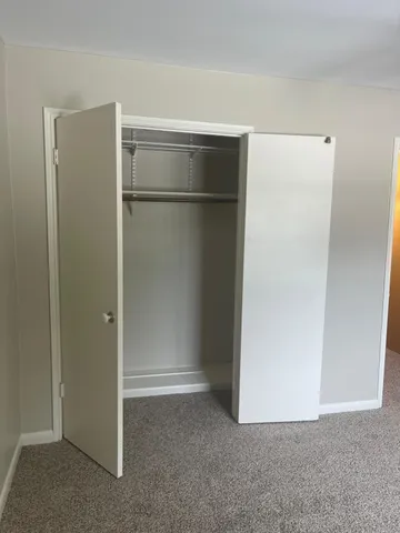 a view of a hallway with chandelier