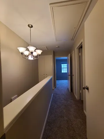 a view of a house with a yard and plants