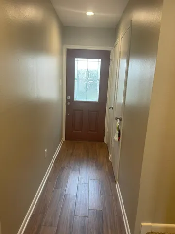 a view of entryway with wooden floor