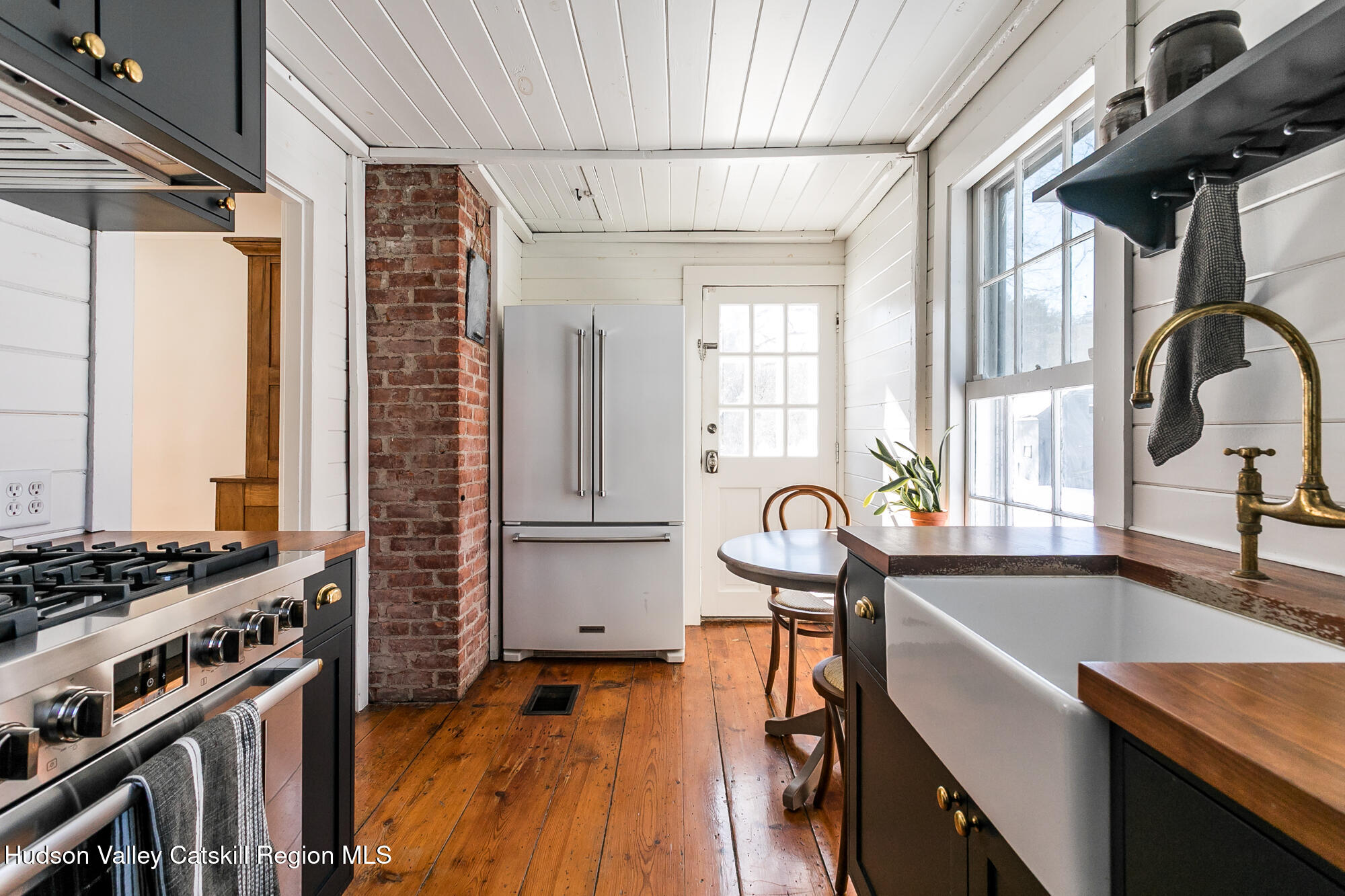 8 George Sickle Road Saugerties, NY 12477 - Photo 12 of 26 a kitchen with granite countertop a stove and a sink