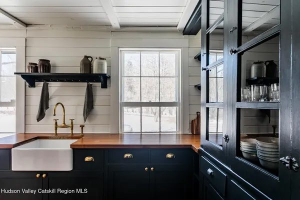 a kitchen with a sink and cabinets