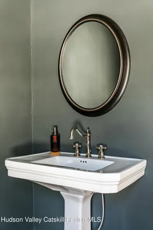 a bathroom with a sink and mirror
