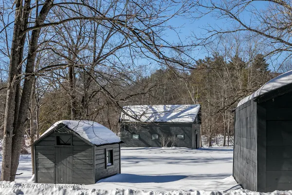 a view of a yard and front view of a house