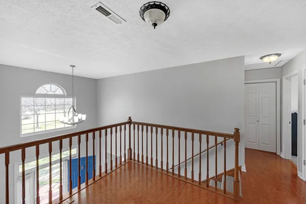 a view of staircase with rug floor