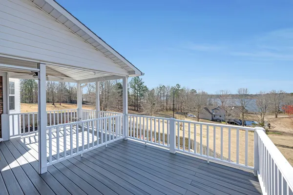 a view of a wooden balcony with outdoor space