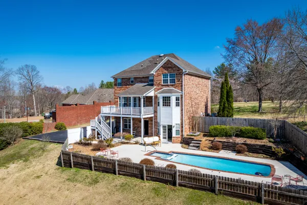 a front view of a house with swimming pool