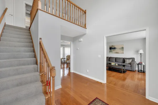 a view of a livingroom with furniture and stairs