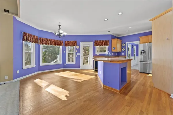 a kitchen with stainless steel appliances granite countertop a stove and a refrigerator
