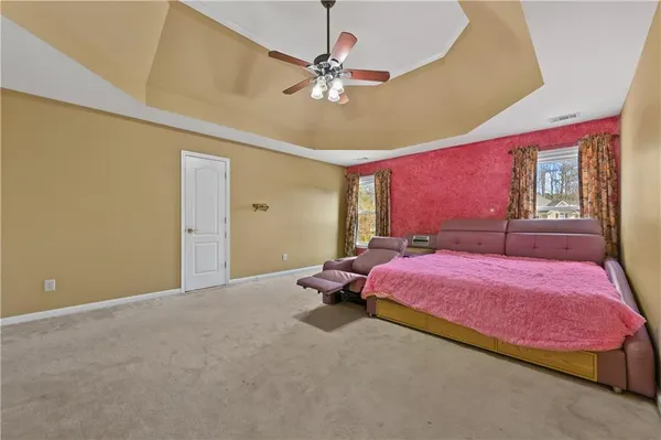 a bed room with a bed and a chandelier