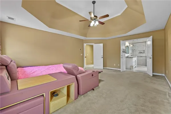 a spacious bathroom with double sink shower and mirror