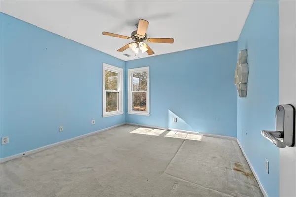 a view of an empty room with a window