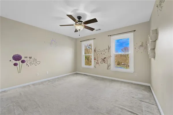 a view of a livingroom with a ceiling fan