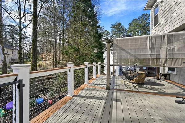 a front view of a house with swimming pool and sitting area