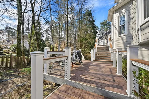 an aerial view of a house with outdoor seating