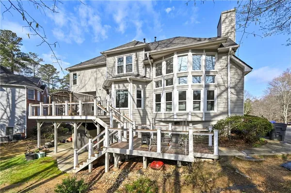 an aerial view of a house with outdoor space