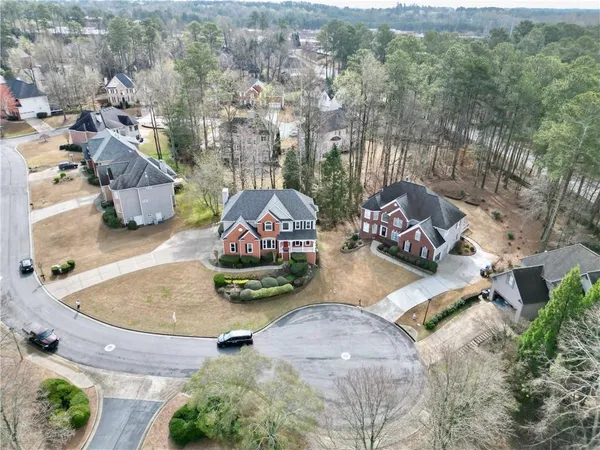 an aerial view of a house with garden space and sitting space