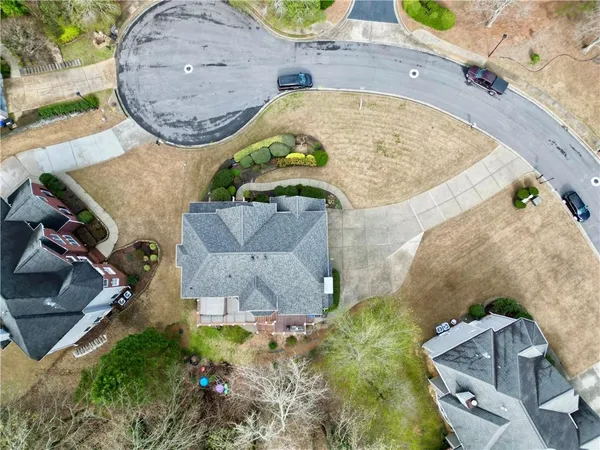 an aerial view of a house with a swimming pool