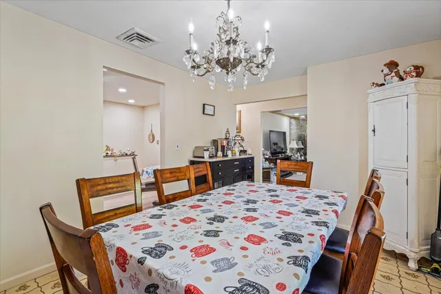 a very nice looking dining room with a table and chairs