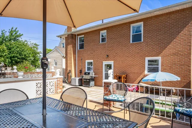 a outdoor space with lots of chairs and a stove