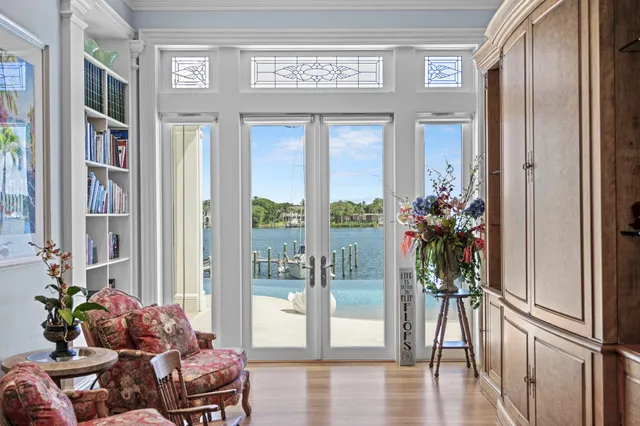 a bathroom with a granite countertop double vanity sink and a mirror