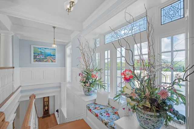a bathroom with a granite countertop double vanity sink and mirror