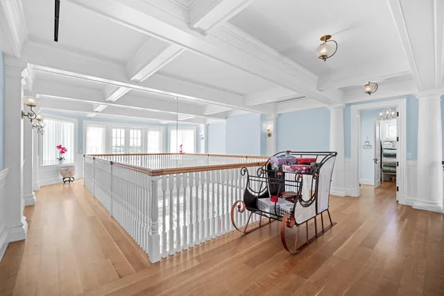 a swimming pool with outdoor seating and lake view