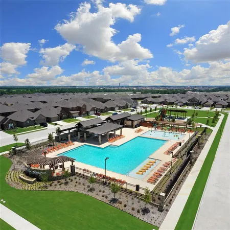 a view of a swimming pool with an outdoor seating