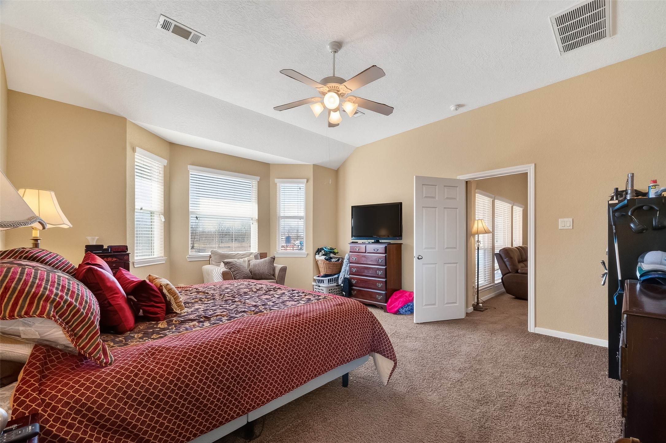 3418 Barbers Hill Road Highlands, TX 77562 - Photo 31 of 50 a bedroom with a bed and a flat screen tv