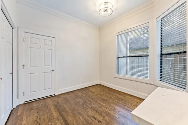 a spacious bedroom with a bed and a couch