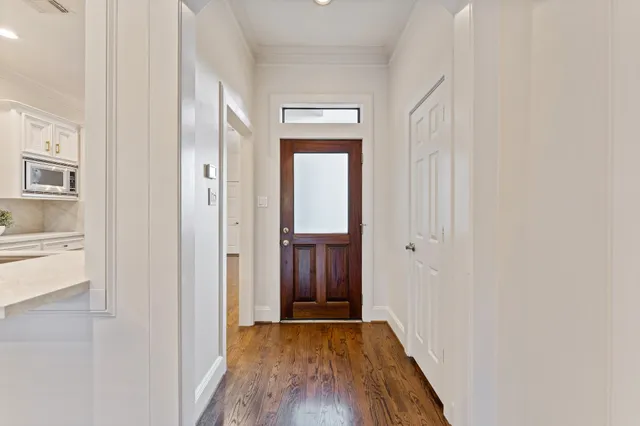 a spacious bathroom with a double vanity sink a large mirror a shower and bathtub