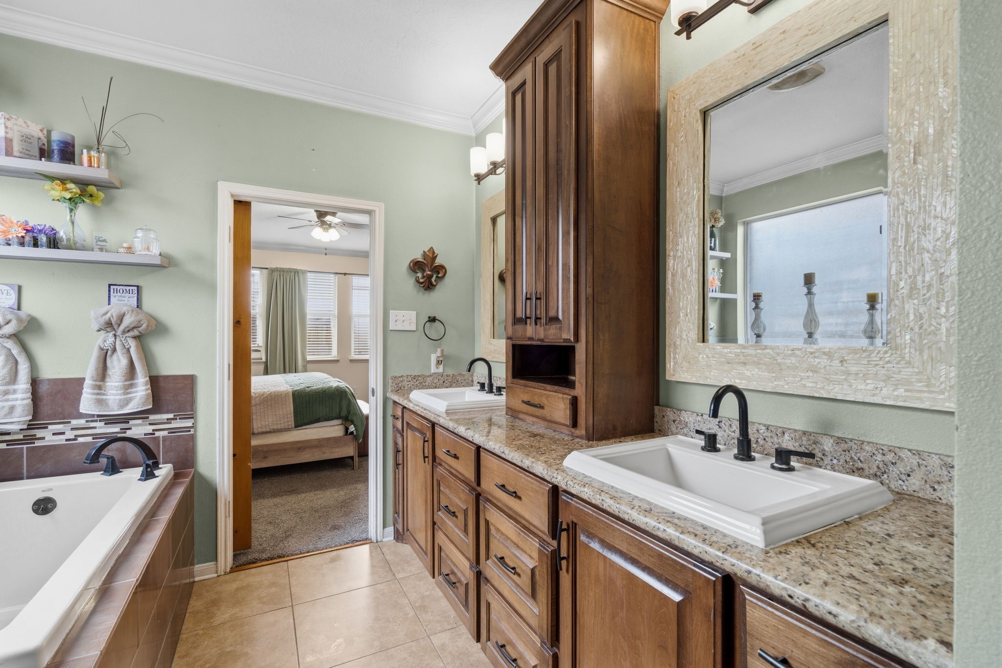 1319 Collier Point Lane Fresno, TX 77545 - Photo 20 of 33 The primary vanity area features generous counter space, abundant cabinetry, and updated fixtures for both beauty and function.
